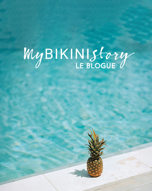 Ananas pos&eacute; sur le bord d'une piscine. 