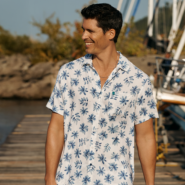 A man wearing a floral shirt from Shoreline Seven – Bikini Village