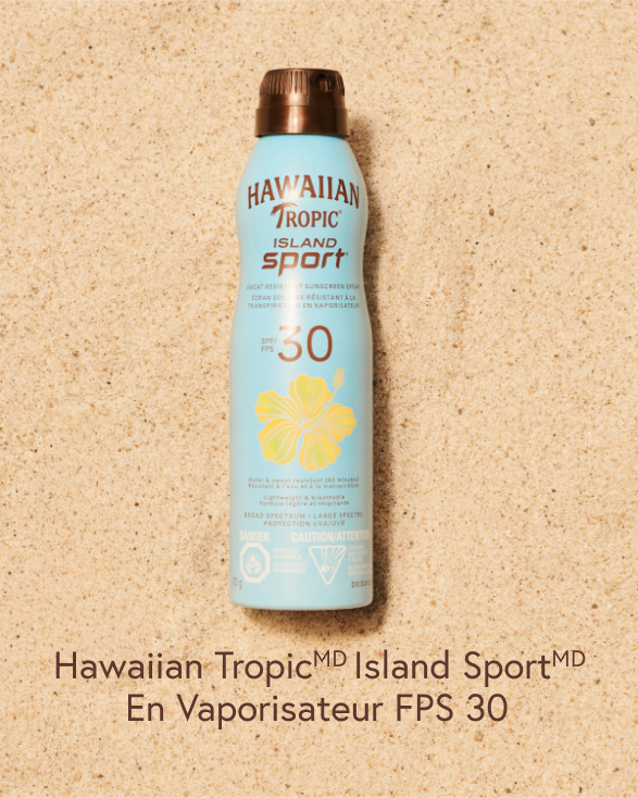 Vaporisateur FPS 30 d’Hawaiian Tropic sur le sable.